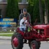 Michigan seniors arrive at school in style on Tractor Day