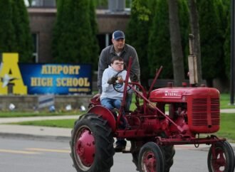 Michigan seniors arrive at school in style on Tractor Day
