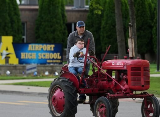 Michigan seniors arrive at school in style on Tractor Day
