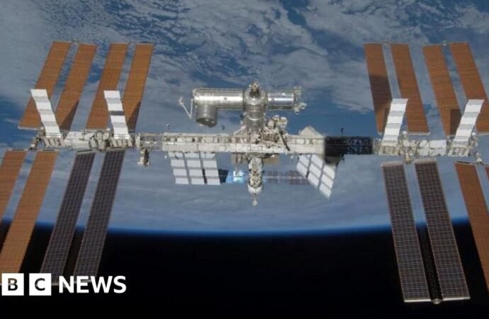 Astronauts return to ISS after sheltering during air leak repair attempt