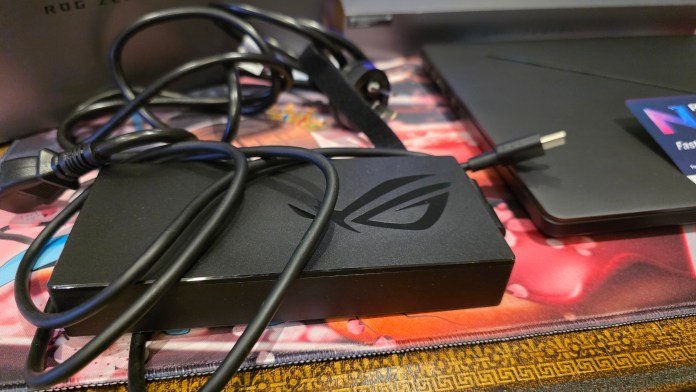 The power brick showing its cables and velcro tie.