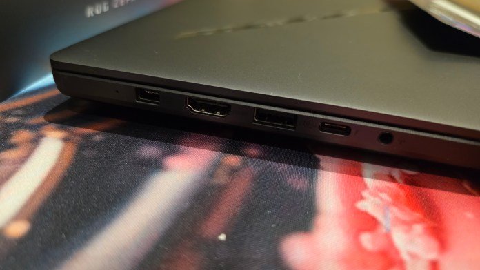 Left side of the laptop showing the power port, HDMI port, USB-A slot, USB-C slot and AUX connector.