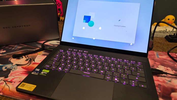 Showing laptop keyboard, tenkeyless keyboard with programmable M keys. The keys light up purple.
