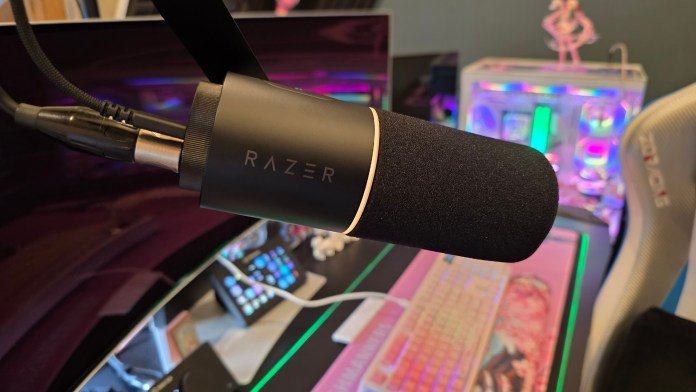 Side profile of the microphone showing it mounted on a microphone arm and the USB C and XLR cables connected to the microphone.