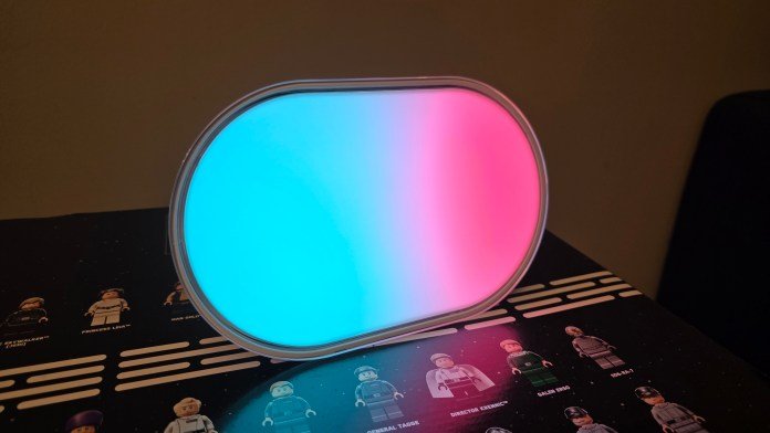 LIFX Luna lit up with a beautiful aqua blue transforming into a pink light.