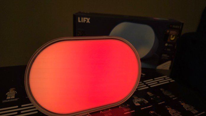 LIFX Luna lit up with a beautiful red color transforming into orange light.