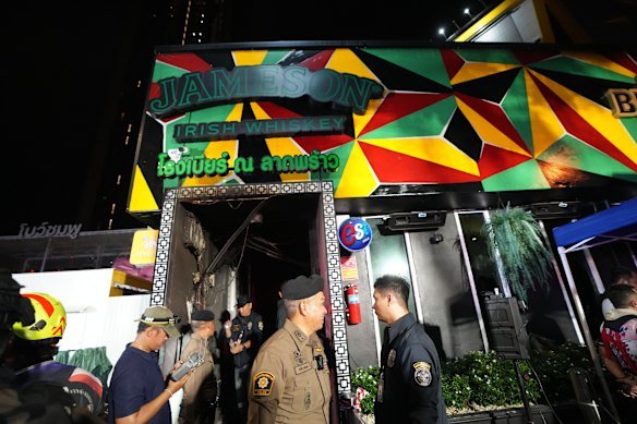 Rescuers and other people at the scene of the fire.