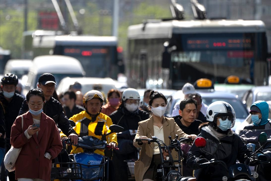 Commuters during the morning rush hour in Beijing in April 2023