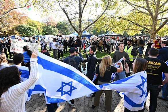 Members of the Jewish community gather outside a pro-Palestinian camp at the University of Melbourne.