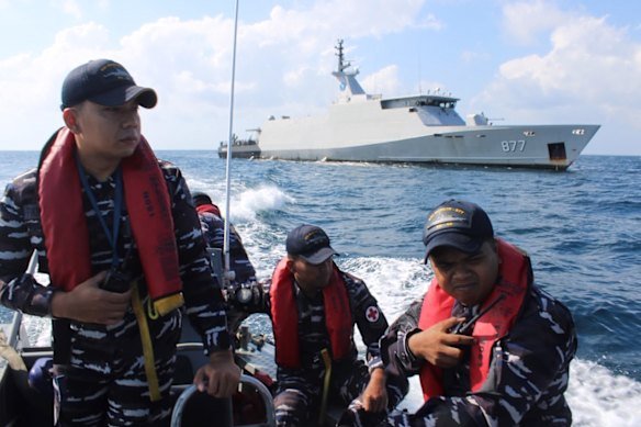 Indonesian Navy personnel sail an inflatable boat during the search for victims after a passenger boat sank in the waters near Balaloho Island in South Sulawesi on July 15.