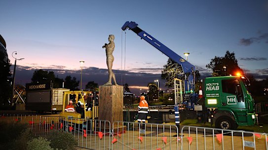 PERTH, AUSTRALIA - JULY 5: The statue of former AFL player Nicky Winmar is removed from the outside of Optus Stadium on July 5, 2026 in Perth, Australia. Winmar was found guilty last week of assault in a Victorian court. (Photo by Paul Kane/Getty Images)