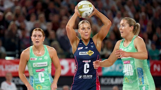 Melbourne Vixens captain Kate Moloney passes the ball during the Super Netball grand final against West Coast Fever in August.