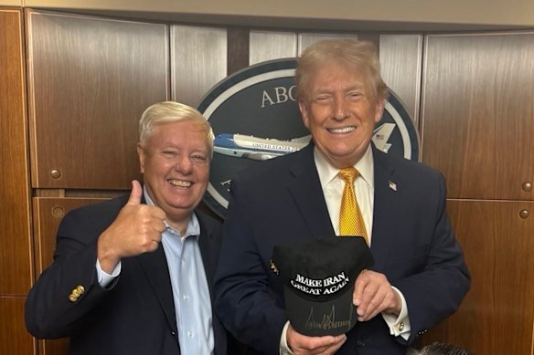 Republican Senator Lindsey Graham meets with President Donald Trump holding a Make Iran Great Again hat.