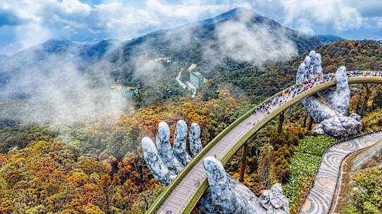 The Golden Bridge is lifted by two giant hands at the Ba Na Hills resort in Da Nang, Vietnam.