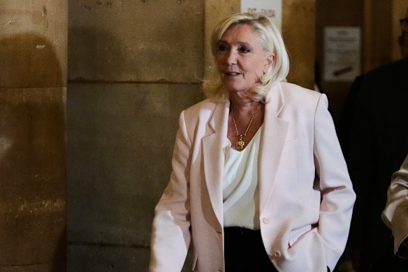 Far-right leader Marine Le Pen arrives at the courtroom to hear the verdict of her appeal in Paris.