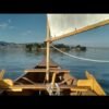 A man turns a canoe into a sailboat and tests it