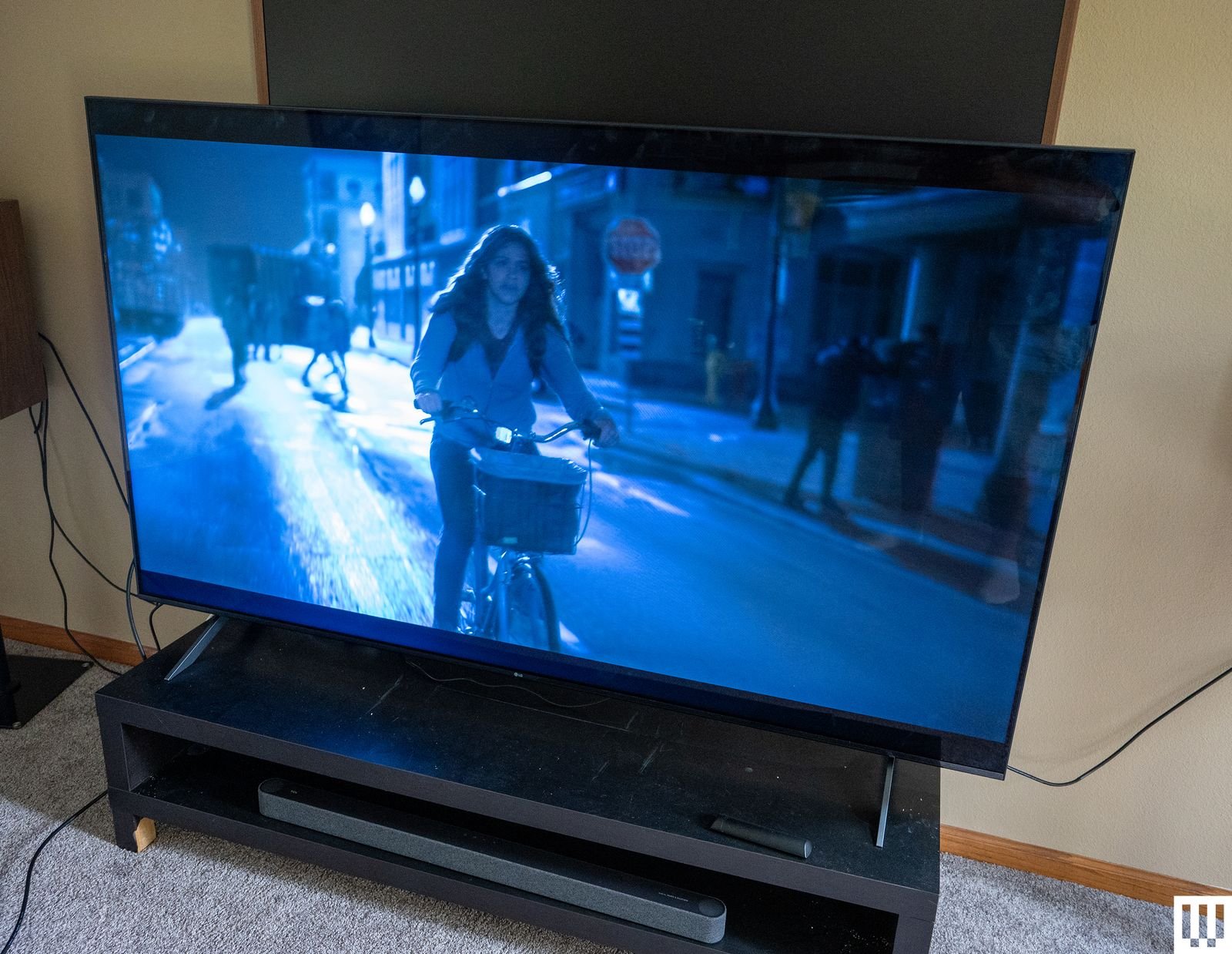Image may contain Gina Rodriguez Computer hardware Electronic hardware Monitor Screen TV Adult person and bicycle