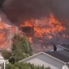 Helicopters drop water as massive fire in Norway destroys homes