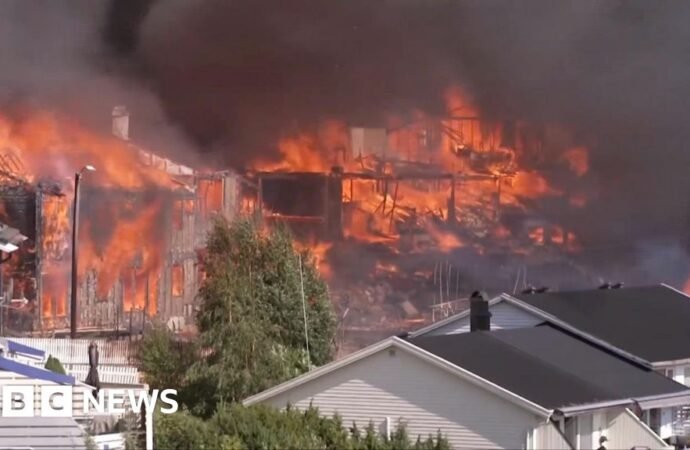 Helicopters drop water as massive fire in Norway destroys homes
