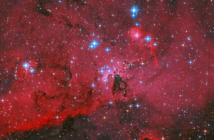 Hubble sees crimson clouds and stars – NASA