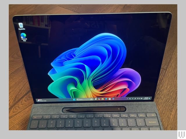 Close-up of a tablet screen and a slot that holds a stylus just above the keyboard