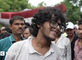 Protesters celebrate resignation of India’s education minister