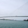 The bridge between the United States and Canada has been under construction for years. But the tension between countries is undermining the joy