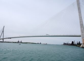 The bridge between the United States and Canada has been under construction for years. But the tension between countries is undermining the joy