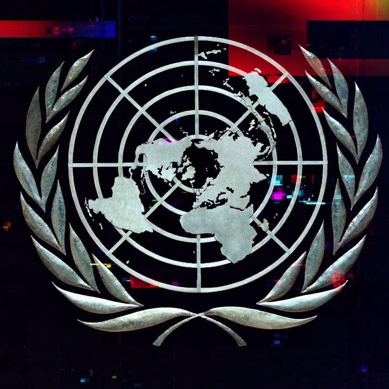 A photo illustration of the United Nations symbol with a glitch effect overlaid.