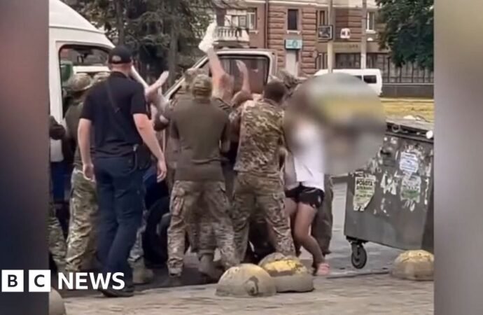 Why do Ukrainian military recruiters face violence in their own country?
