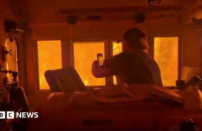 Wildfires in Canada leave train ‘engulfed in flames’ as smoke heads toward US