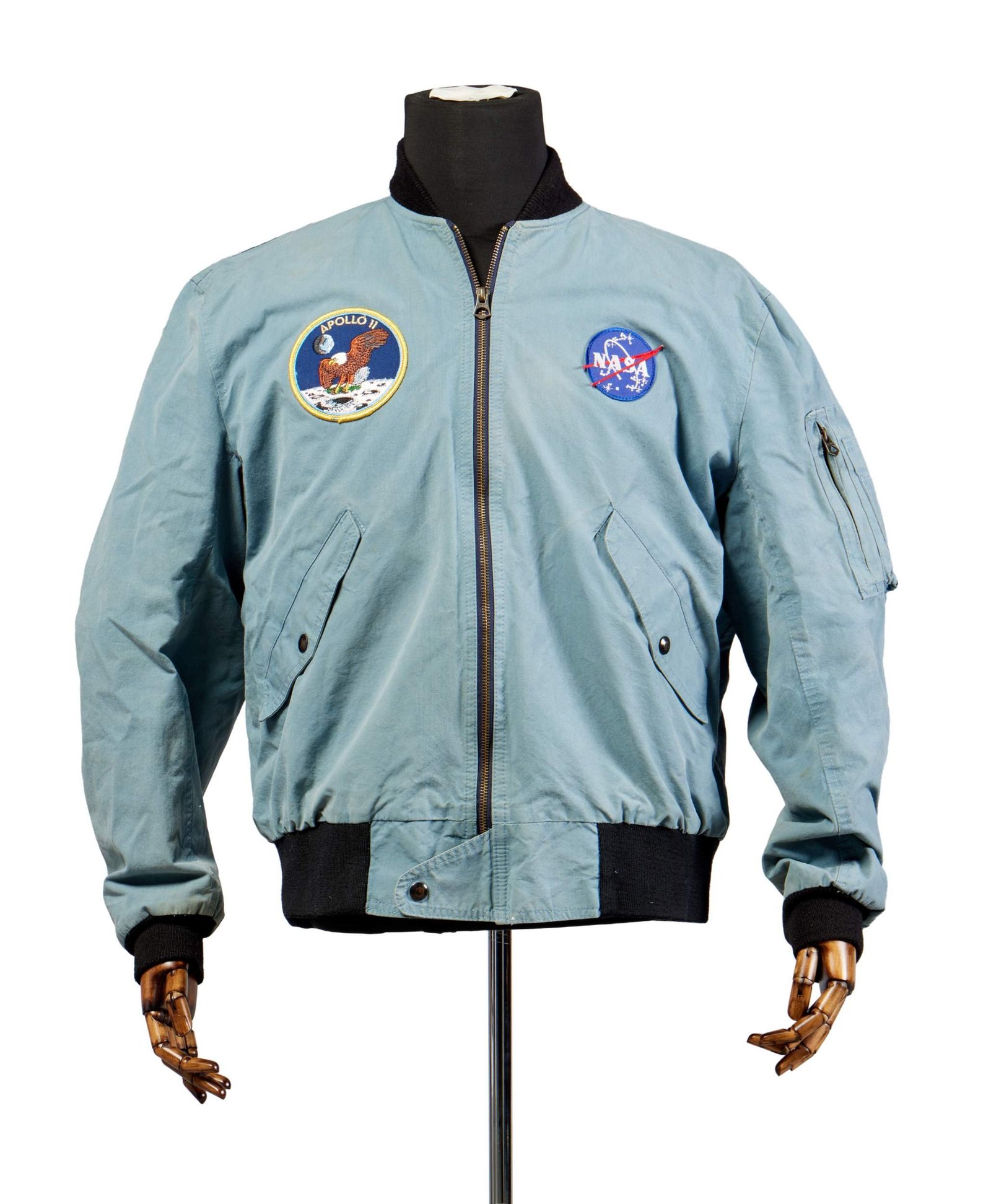 a blue bomber jacket with an Apollo 11 patch