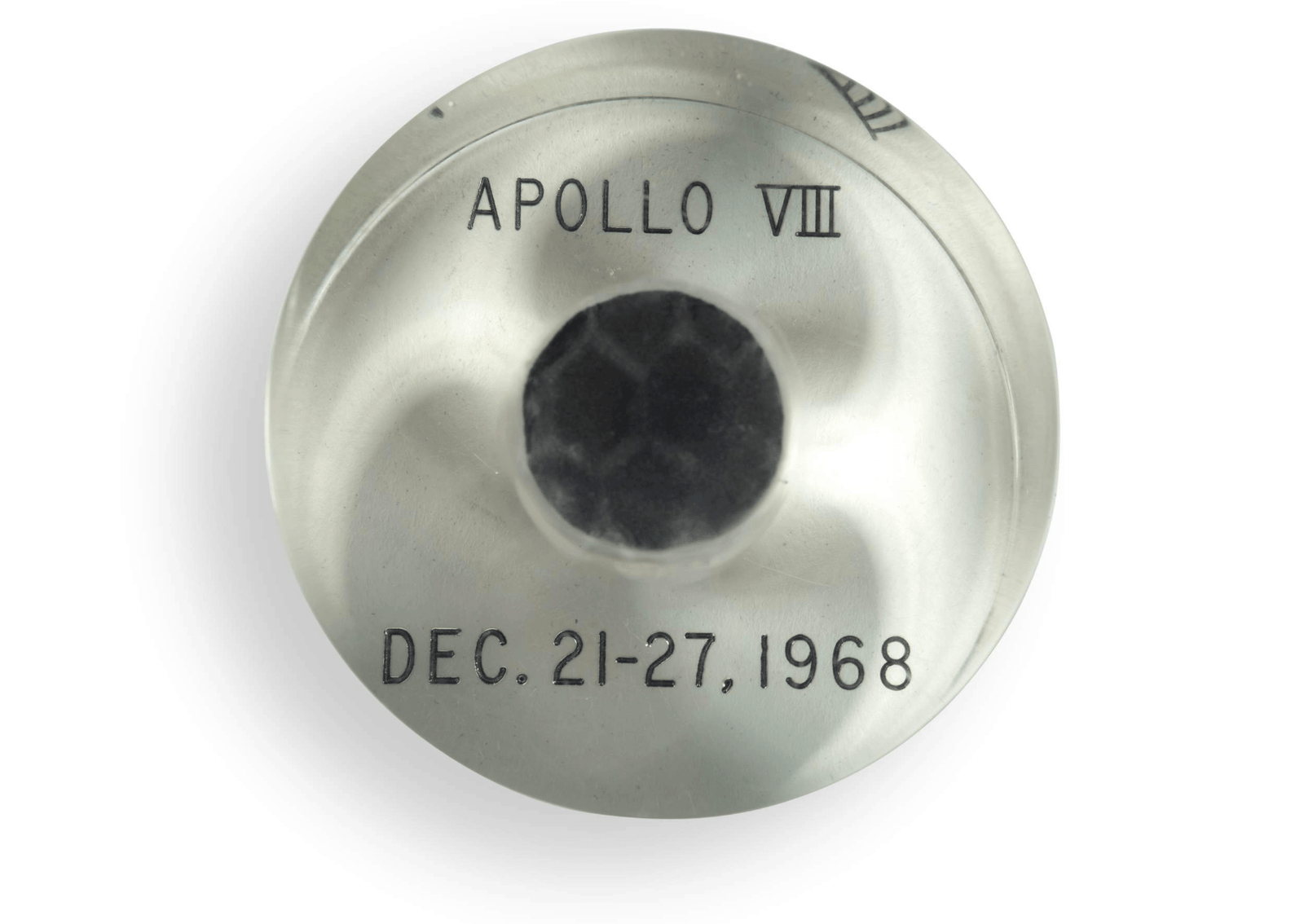 A silver disc with the words Apollo 8.
