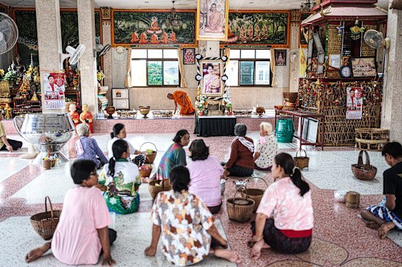 The family of 17-year-old Thanchanok Donhomla attend a ceremony at a Buddhist temple in Kalasin.