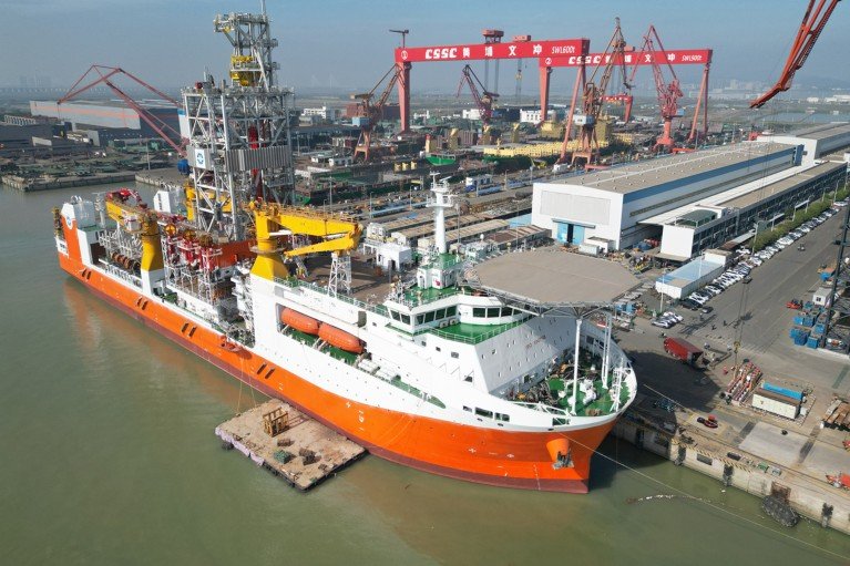 Aerial view of China's ultra-deepwater drillship Meng Xiang docked in a port.