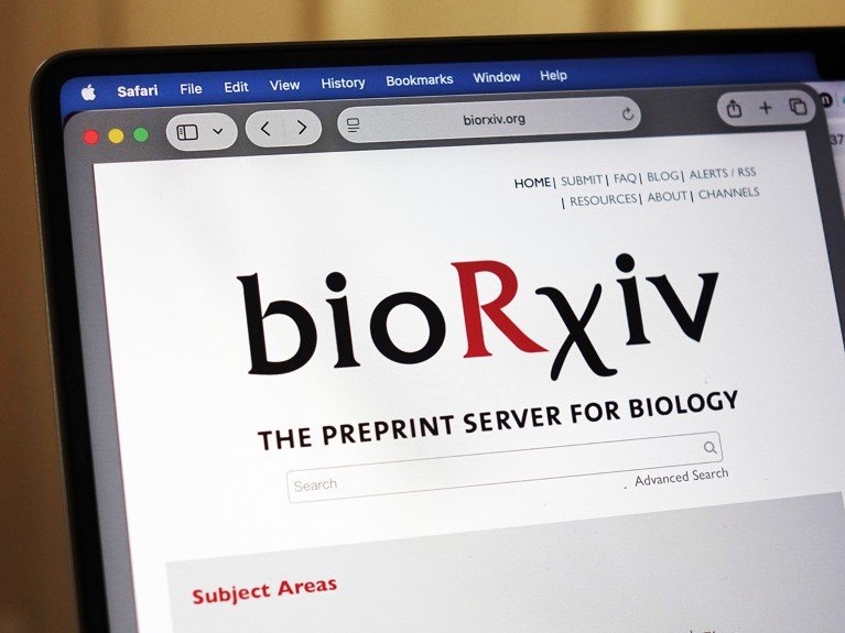 A close-up view of a laptop screen displaying the bioRxiv home page in a web browser.