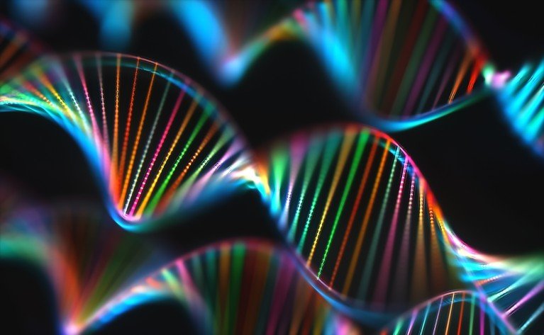 Colorful illustration of multiple DNA double helix strands glowing in vibrant rainbow colors on a black background