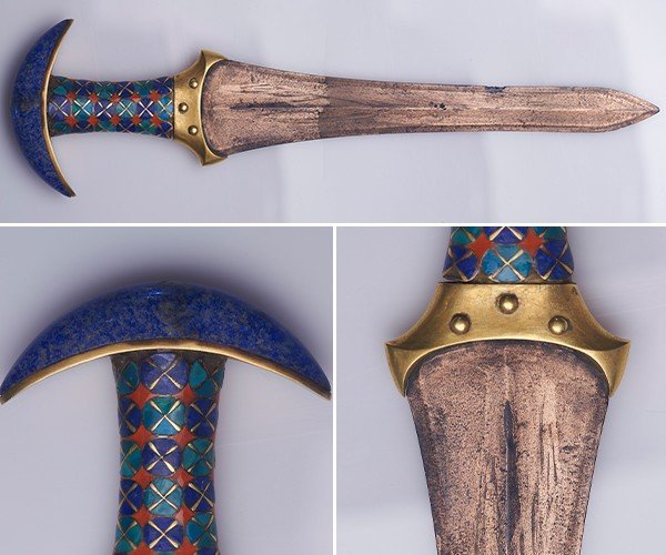 An ancient Egyptian dagger adorned with gold and lapis lazuli.