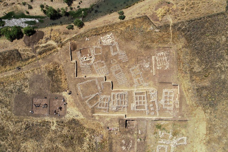 Aerial view showing excavation work being carried out at the Neolithic agricultural settlement of Çayönü in Türkiye.