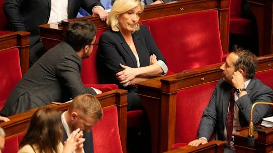 French far-right leader Marine Le Pen (center) reacts in the National Assembly during a session on Tuesday.