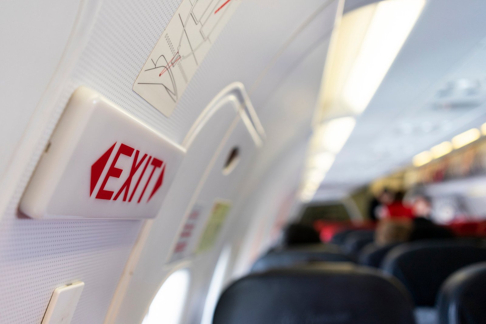 Closeup of a sign on an airplane near the emergency exit doors