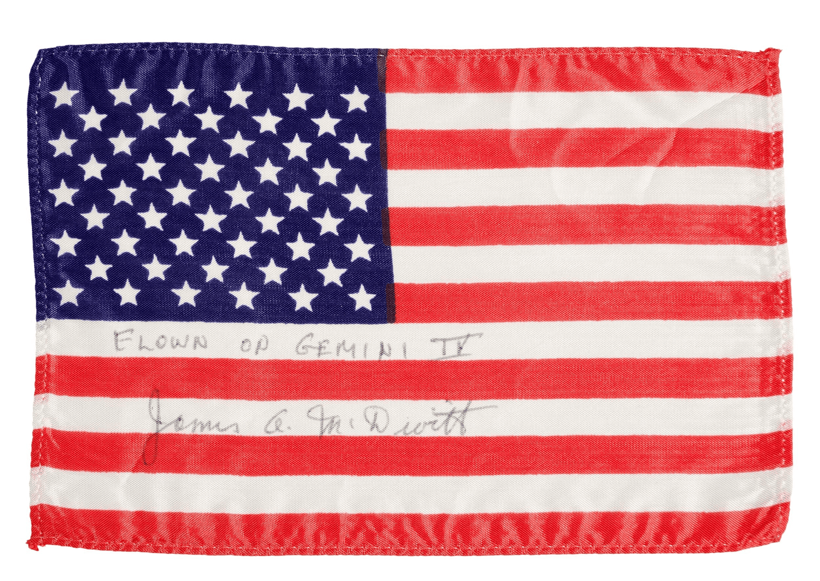 The Gemini IV flag is a silk stars and stripes flag and is signed and inscribed by McDivitt on the lower two white bars.