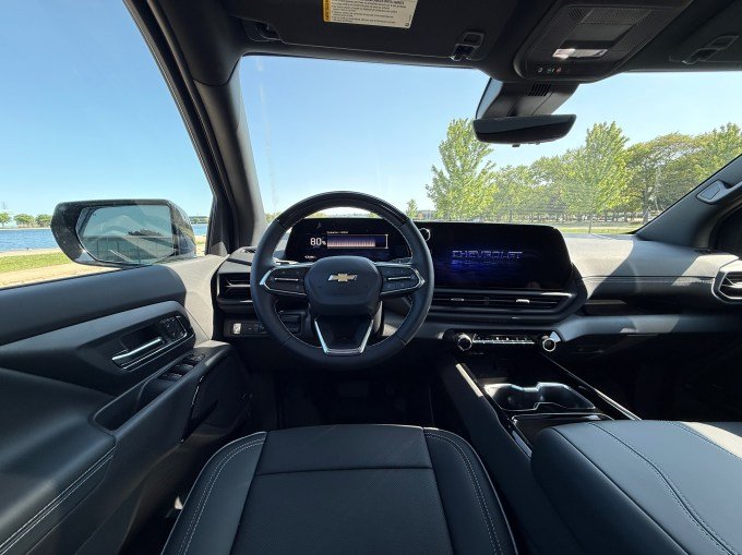 A screen shows 80% inside an electric van.