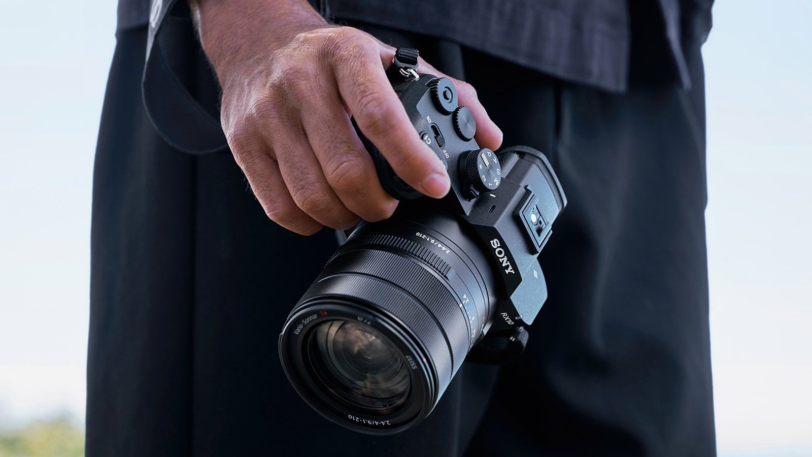 Sony RX10 V bridge camera in a person's hand