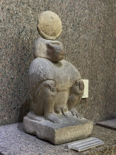 a statue of an ancient egyptian god depicted as a baboon