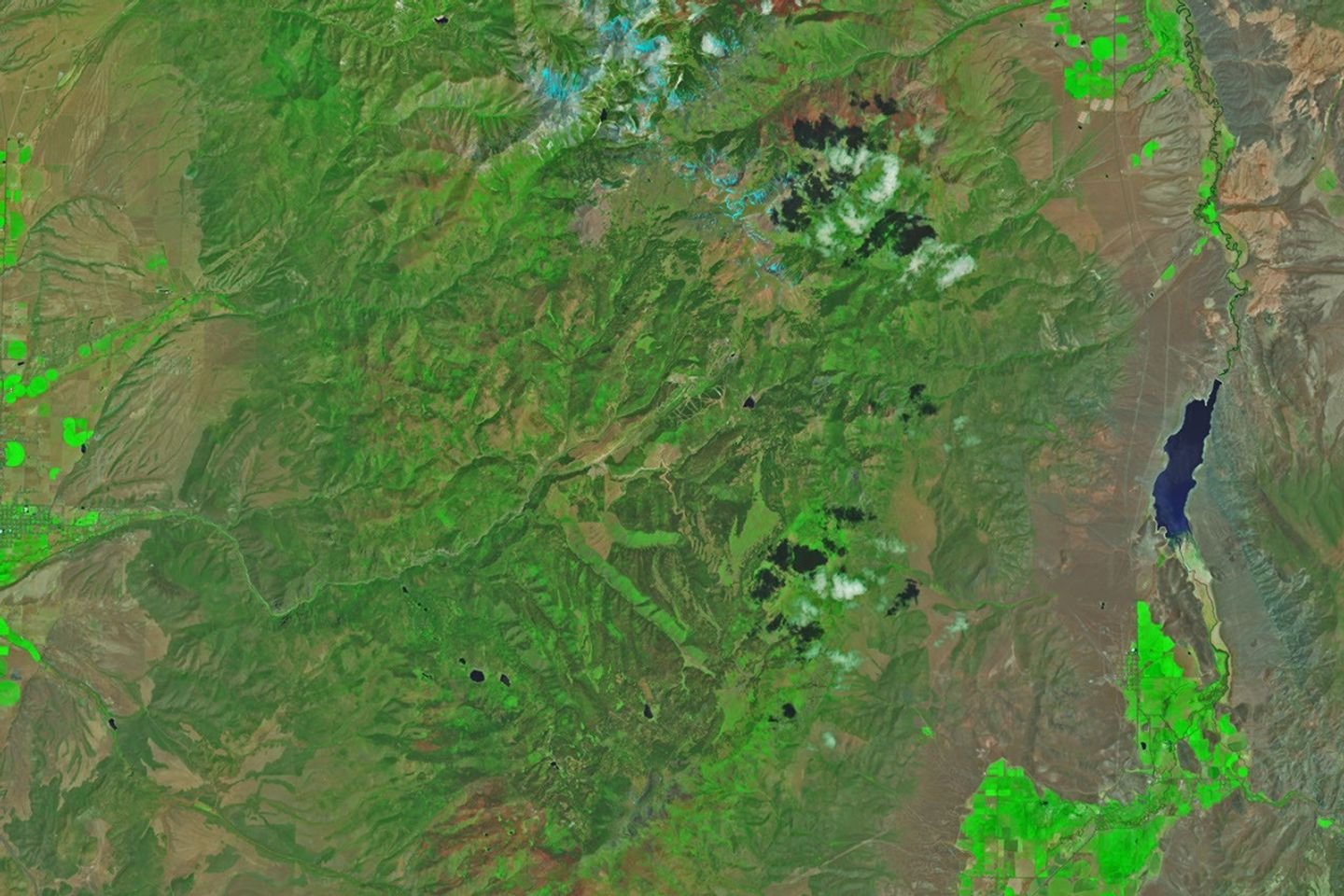 Mountain landscapes appear green and untouched by fire in a satellite image acquired on June 5, 2026.