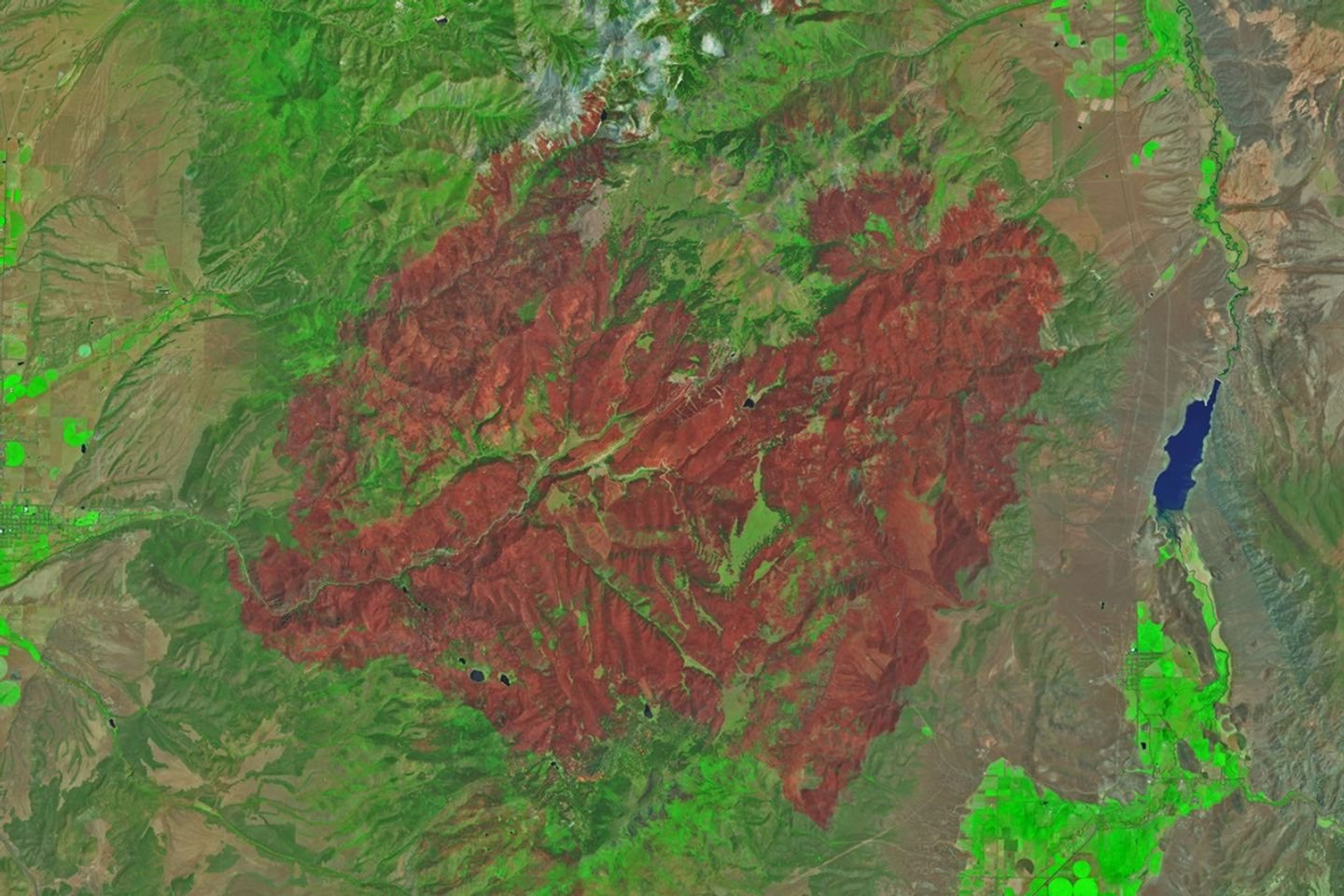 An image of the same area shows a large brown spot that encompasses much of the image acquired after the fire on June 29, 2026.