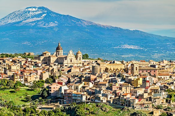 The commune of Militello in Val di Catania overlooked by a subdued Mount Etna.