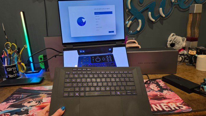 Detachable keyboard, shown my hand and still lit up working.