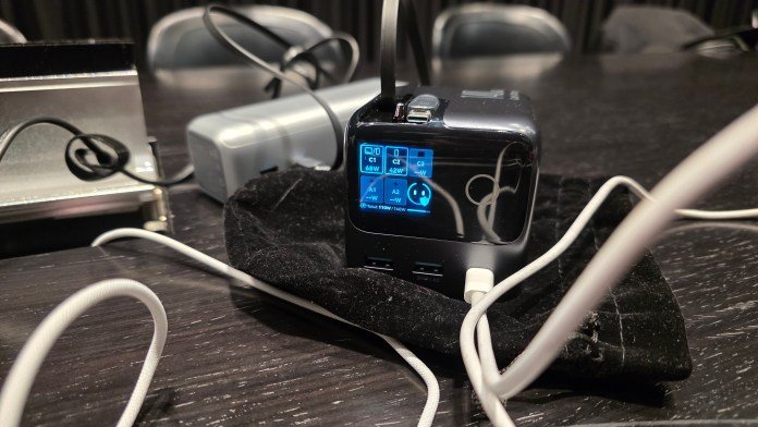 Power charger plugged in with two ports used. Both at 68W and 42 W respectively.